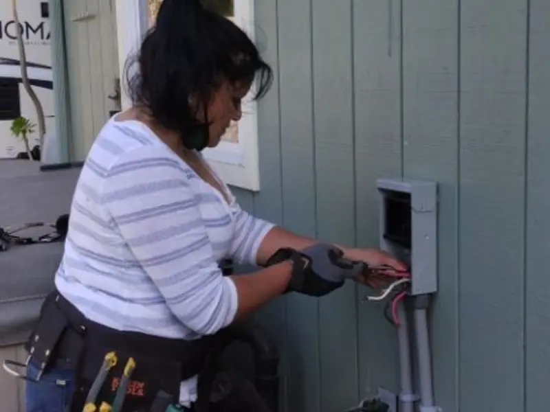 Licensed electrician wiring an exterior subpanel in Rotterdam